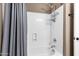 Close up of shower with new shower head and built-in seat at 3033 W Redwood Ln, Phoenix, AZ 85045
