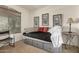 Bedroom with modern paintings and a bed with storage drawers at 309 W Settlers Trl, Casa Grande, AZ 85122