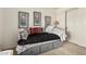 Bedroom with modern paintings and a bed with storage drawers at 309 W Settlers Trl, Casa Grande, AZ 85122