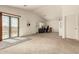 Spacious bonus room features a desk area, sliding glass doors and neutral carpet at 309 W Settlers Trl, Casa Grande, AZ 85122