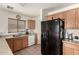 Well-lit kitchen showcasing light wood cabinets and modern appliances, with a window view at 309 W Settlers Trl, Casa Grande, AZ 85122