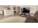 Comfortable living room with tile flooring, a neutral rug, and plush brown sofas at 309 W Settlers Trl, Casa Grande, AZ 85122