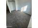 Bedroom with gray carpet flooring, closet, and natural light, making it a comfortable and inviting space at 320 E Mckellips Rd # 152, Mesa, AZ 85201