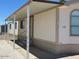 Side view of single Gathering home with a covered parking area and easy access to the entrance at 320 E Mckellips Rd # 152, Mesa, AZ 85201