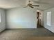 Inviting living room featuring carpeted floors, neutral walls, and abundant natural light at 320 E Mckellips Rd # 152, Mesa, AZ 85201