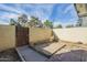 Fenced backyard with concrete patio area and mature trees at 3222 W Royal Palm Rd, Phoenix, AZ 85051