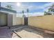 Enclosed backyard with brick-lined edges and a gated entrance at 3222 W Royal Palm Rd, Phoenix, AZ 85051
