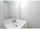Clean and modern bathroom with a white vanity, faucet, and a bright mirror at 3222 W Royal Palm Rd, Phoenix, AZ 85051