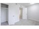 Bright bedroom with an open closet and a connecting door to the bathroom at 3222 W Royal Palm Rd, Phoenix, AZ 85051