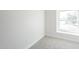 Bright bedroom with a large window and plush carpet flooring at 3222 W Royal Palm Rd, Phoenix, AZ 85051