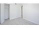 Neutrally painted bedroom with an open closet and carpeted flooring at 3222 W Royal Palm Rd, Phoenix, AZ 85051