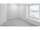 Carpeted bedroom with a window providing natural light at 3222 W Royal Palm Rd, Phoenix, AZ 85051