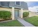 Charming exterior featuring well-kept landscaping, a blue door and complementary trim under a sunny sky at 3222 W Royal Palm Rd, Phoenix, AZ 85051