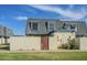 Charming townhome featuring a gray roof, a private front patio with access gate, and lush, green common areas at 3222 W Royal Palm Rd, Phoenix, AZ 85051
