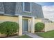 Charming exterior featuring well-kept landscaping, a blue door and complementary trim under a sunny sky at 3222 W Royal Palm Rd, Phoenix, AZ 85051
