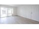 Bright living space with modern flooring, access to the backyard through sliding glass doors and closet space at 3222 W Royal Palm Rd, Phoenix, AZ 85051