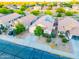 An aerial view shows the beautiful desert landscaping and tile roofs of this suburban neighborhood home at 33105 N Double Bar Rd, San Tan Valley, AZ 85144