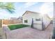 Well-maintained backyard with artificial turf and brick pavers, perfect for outdoor entertaining at 33105 N Double Bar Rd, San Tan Valley, AZ 85144