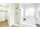 Bright bathroom with a shower, soaking tub, and a window, with a walk-in closet nearby at 33105 N Double Bar Rd, San Tan Valley, AZ 85144