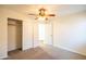 This comfortable bedroom includes carpet, a ceiling fan, and a closet with doors at 33105 N Double Bar Rd, San Tan Valley, AZ 85144