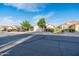 Charming single-story home featuring a two-car garage, desert landscaping, and mature shade trees at 33105 N Double Bar Rd, San Tan Valley, AZ 85144