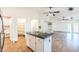 A modern, open concept kitchen features a large island, stainless steel appliances, and walk-in pantry at 33105 N Double Bar Rd, San Tan Valley, AZ 85144