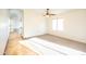 This carpeted room has natural light, ceiling fan, and tile entry, creating a bright, inviting space at 33105 N Double Bar Rd, San Tan Valley, AZ 85144