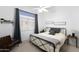 Bedroom featuring a metal bed frame, ceiling fan, and side tables with accent lamps at 341 E Constitution Dr, Gilbert, AZ 85296