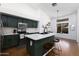 Stylish kitchen featuring green cabinets, marble counters, stainless steel appliances, and a large island at 341 E Constitution Dr, Gilbert, AZ 85296