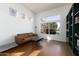 Cozy living room featuring hardwood floors, neutral decor, and large windows for ample natural light at 341 E Constitution Dr, Gilbert, AZ 85296