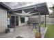 Inviting backyard with a covered patio, artificial grass, and stylish outdoor seating at 4009 S Siesta Ln, Tempe, AZ 85282