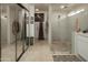 Clean bathroom featuring a glass shower, large mirror, and tiled floors at 4009 S Siesta Ln, Tempe, AZ 85282