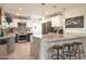 Bright kitchen with stainless steel appliances, granite counters, and breakfast bar at 4009 S Siesta Ln, Tempe, AZ 85282