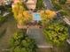 Aerial view shows community pool and basketball court surrounded by lush green trees at 4313 E Jasper Dr, Gilbert, AZ 85296