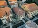 An aerial view of clustered houses with red roofs surrounded by sidewalks and green trees at 4313 E Jasper Dr, Gilbert, AZ 85296