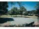 Community basketball court is surrounded by green trees and offers great recreation activities at 4313 E Jasper Dr, Gilbert, AZ 85296
