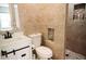 This bathroom features a white vanity, stylish tiling, a modern toilet, and a walk-in shower at 4313 E Jasper Dr, Gilbert, AZ 85296