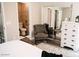 Bright bedroom boasts a bathroom and dresser with large mirrored closet for ample storage at 4313 E Jasper Dr, Gilbert, AZ 85296