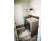 Functional laundry room equipped with modern washer and dryer units, ample storage, and sturdy flooring at 4313 E Jasper Dr, Gilbert, AZ 85296