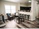 Cozy living space with open kitchen, bar-style seating, and natural light at 4313 E Jasper Dr, Gilbert, AZ 85296