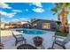 Enjoy the outdoors with a pool, patio, palm tree, and lounging area at 4518 W Rose Ln, Glendale, AZ 85301