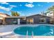 Inviting backyard pool is surrounded by a patio and privacy fencing at 4518 W Rose Ln, Glendale, AZ 85301