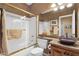 Bathroom featuring granite countertop, tiled walls, framed mirror, and bath tub shower at 4720 E Bighorn Ave, Phoenix, AZ 85044