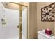 The bathroom features a glass door shower with white tiles and bronze hardware at 4720 E Bighorn Ave, Phoenix, AZ 85044