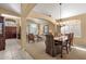 Spacious formal dining room with archways, neutral color scheme, and elegant chandelier at 4720 E Bighorn Ave, Phoenix, AZ 85044