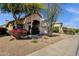 Charming single-story home boasts colorful landscaping, mature trees, and well-maintained lawn at 4720 E Bighorn Ave, Phoenix, AZ 85044