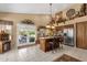 Spacious kitchen features stainless steel appliances, island with pendant lighting, and access to outdoor patio at 4720 E Bighorn Ave, Phoenix, AZ 85044