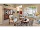 Bright living room with plantation shutters, neutral decor, and an elegant area rug at 4720 E Bighorn Ave, Phoenix, AZ 85044