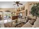 Open-concept living room and kitchen offers modern appliances, bar seating, and stylish decor at 4720 E Bighorn Ave, Phoenix, AZ 85044