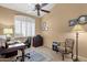 This office features a ceiling fan, a large window with shutters, and a desk at 4720 E Bighorn Ave, Phoenix, AZ 85044